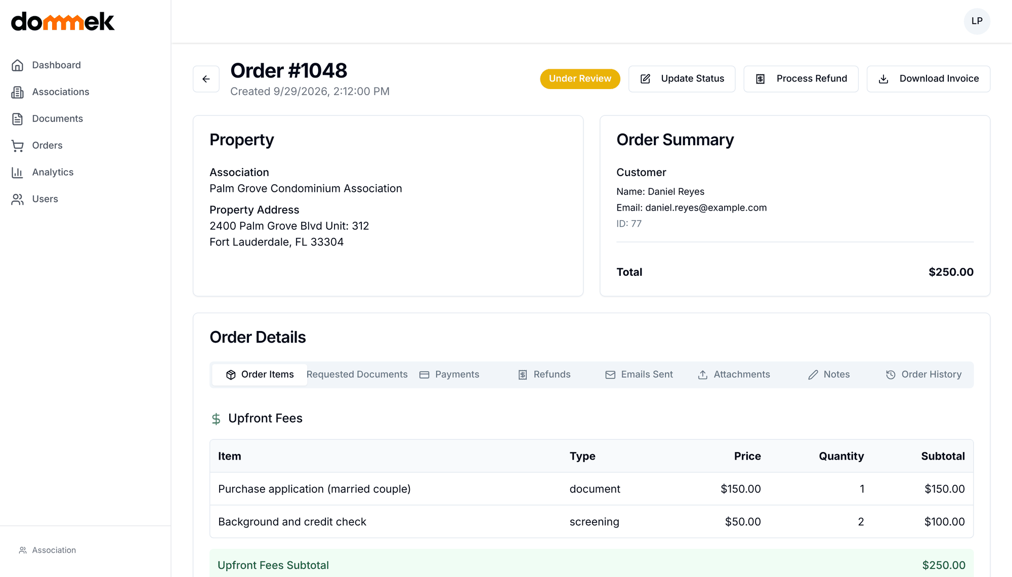 Dommek application detail page showing the property, applicant, review status and fees for a condo purchase application